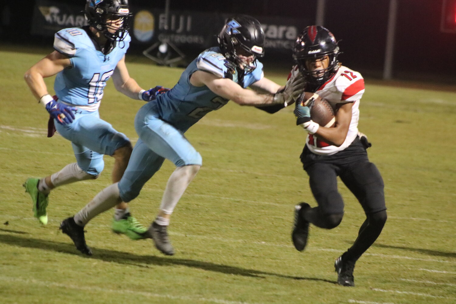 Joe Mahoney pushes a Creekside receiver out of bounds.